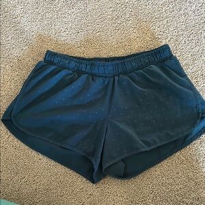 Blue athletic shorts with faint polka dots